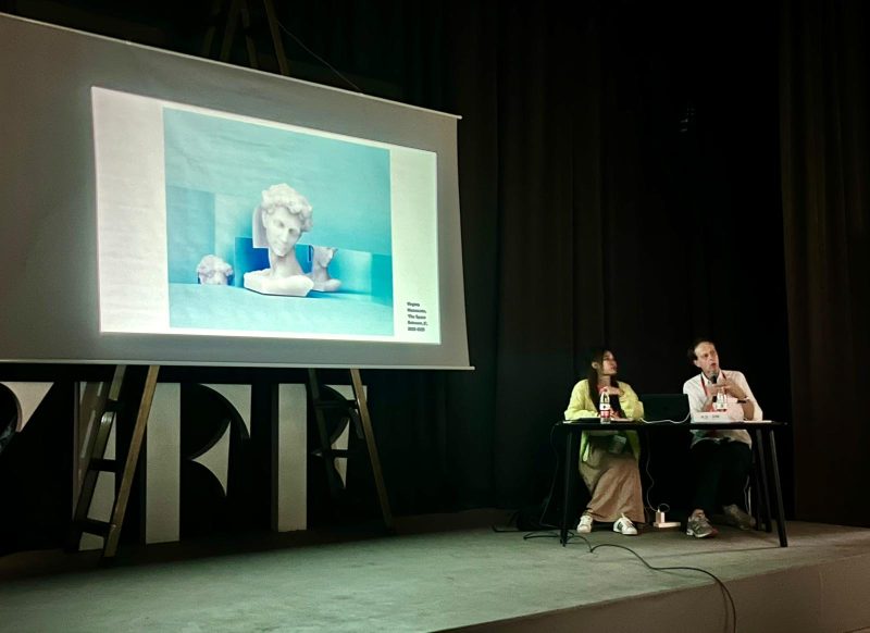 Photograph of Date Bate giving at a presentation at Pingyao International Photography Festival, China 2023