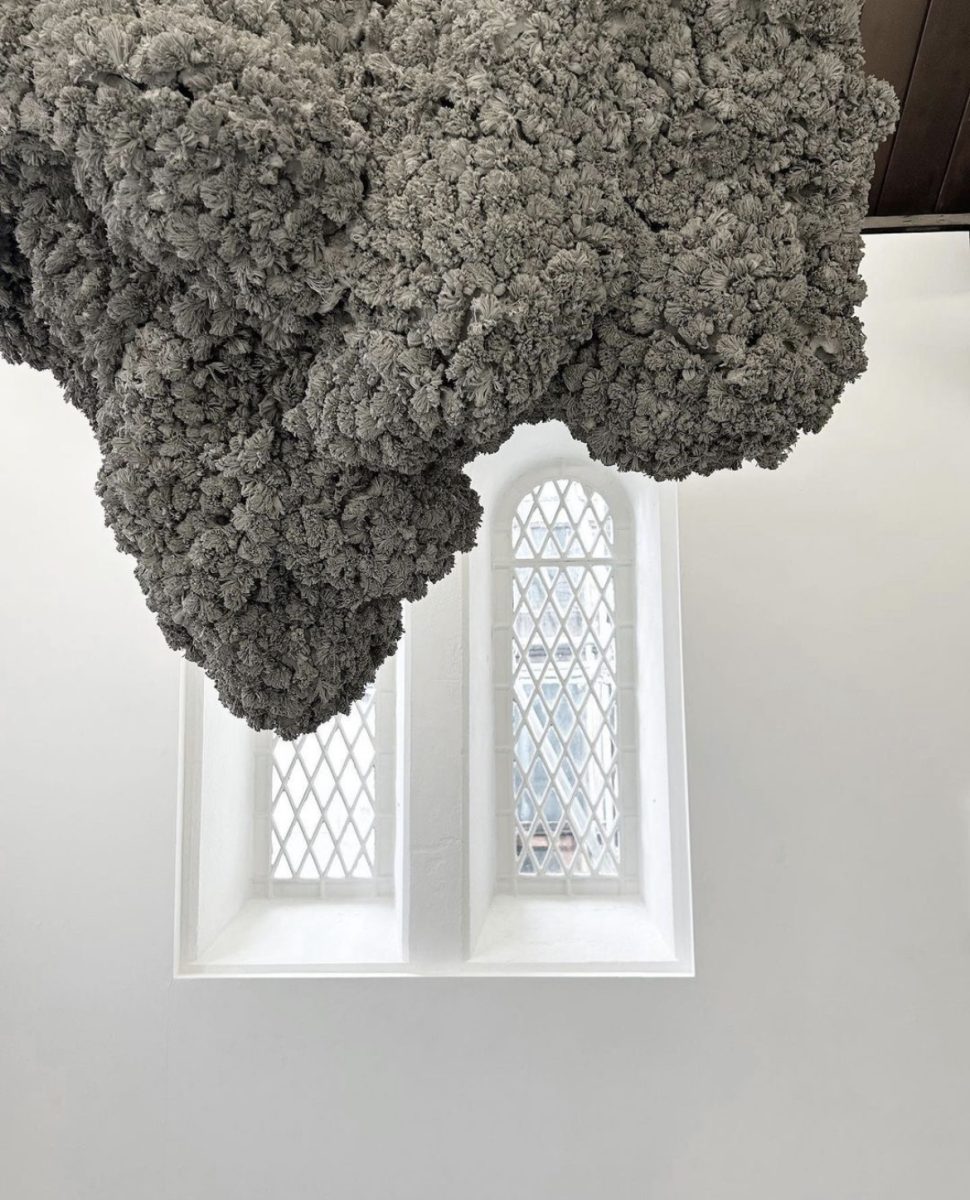 clay sculpture by Phoebe Cummings, appears to be hanging from a ceiling with a window behind